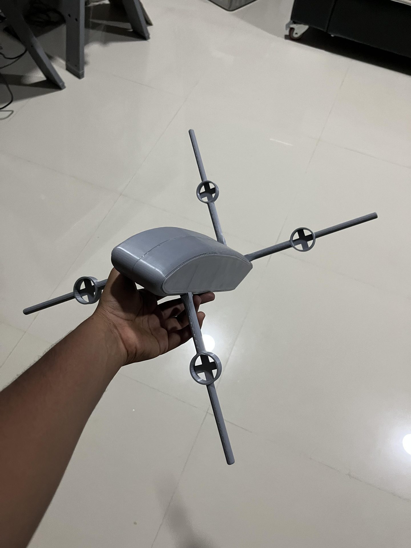 Hand holding 3D printed VTOL prototype